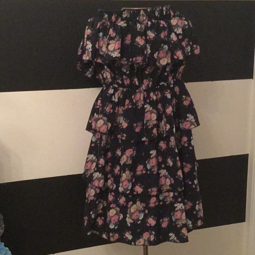 It is a floral dress that is sleeveless.